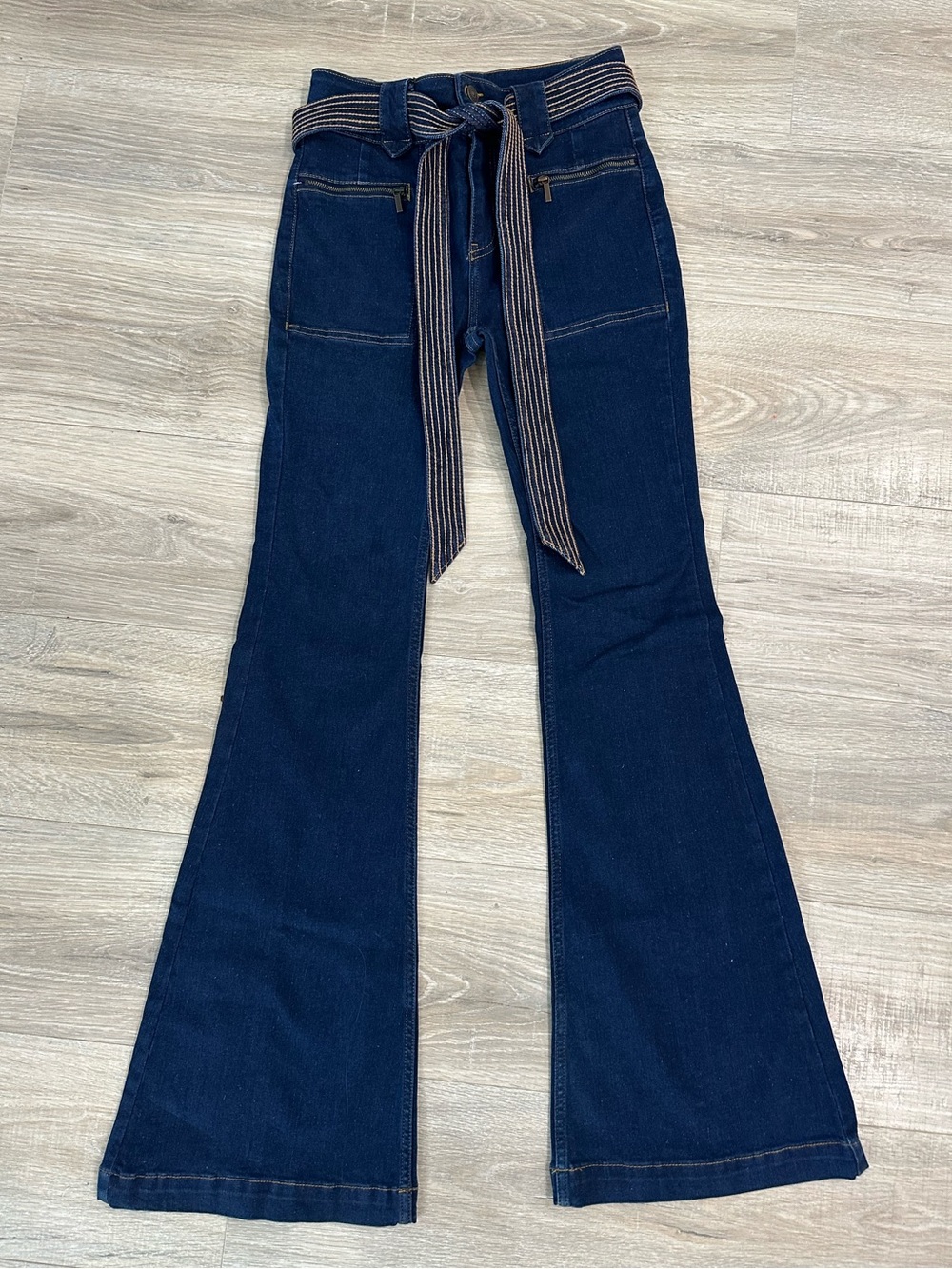We the free free people dark wash high waisted flare leg jeans with denim belt